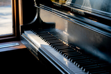 Sun shining on a Steinway piano