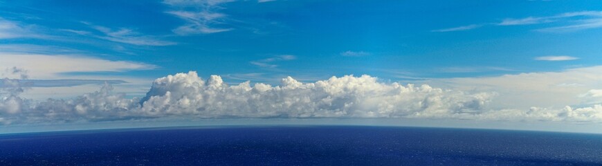 Naklejka na ściany i meble Blue waters of the Atlantic ocean by the horizon