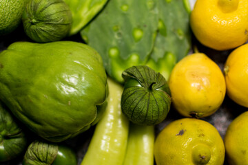 Healthy fresh green and yellow colored fruits and vegetables background