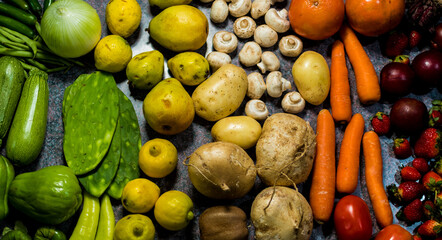 Healthy fresh rainbow colored fruits and vegetables background