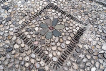 Texture of the cobblestone walkway paved with pebbles