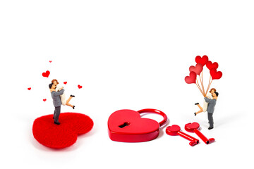 selective focus of miniature couple with heart shape lock isolated on white background 