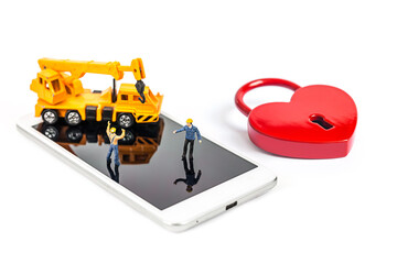 woman hand hold and touch screen smartphone or cellphone with heart  lock shape isolated on white...