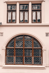 Big old oval window. Old wooden windows on an old building. Architecture in Germany 
