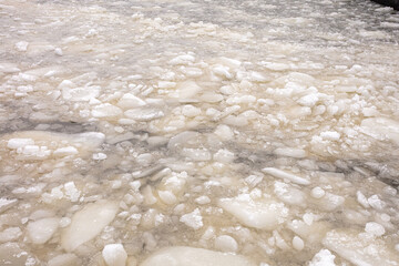 Naklejka na ściany i meble Ice floes, pieces of ice on the sea