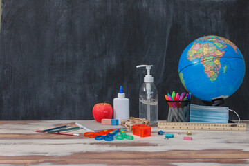 Back To School Covid-19 Supplies on blackboard 