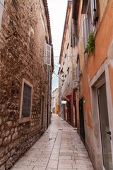 Narrow street of old town of Zadar, Croatia.