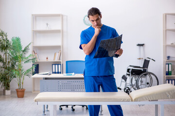 Young male doctor radiologist working in the clinic