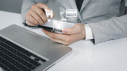 Business people hold smartphone and online shopping concept.
