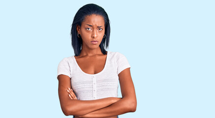 Young african american woman wearing casual clothes skeptic and nervous, disapproving expression on...