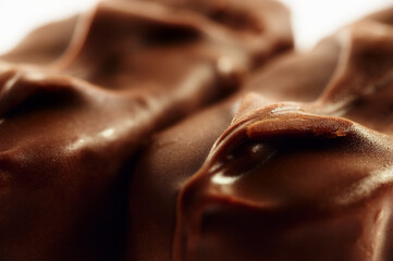 Close-up of a chocolate bar isolated on white background