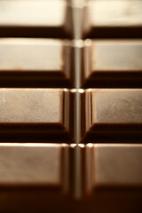 Closeup of a milk chocolate bar full frame.