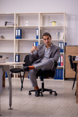 Young male employee working in the office