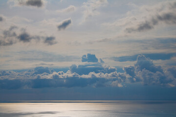 View of clouds, sea and seascape on a sunny day.