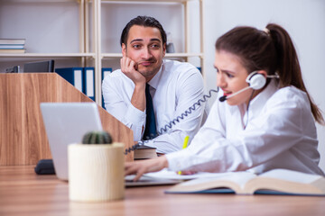 Call center operators working in the office