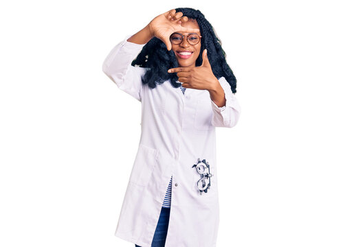 Beautiful african american optician woman with optometry glasses smiling making frame with hands and fingers with happy face. creativity and photography concept.