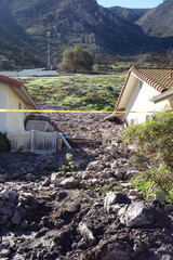 Mudslides destroys house and homes with rocks and debris in suburban area of California