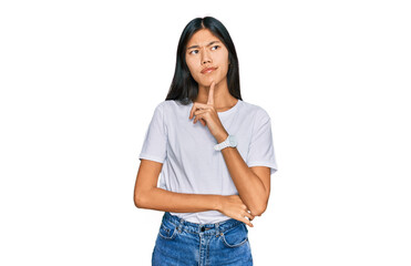 Beautiful young asian woman wearing casual white t shirt thinking concentrated about doubt with...