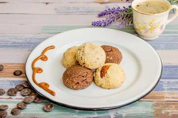 plate of assorted cookies on wooden table