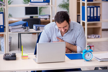 Hungry male employee waiting for food in time management concept