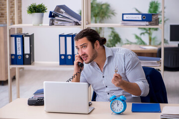 Hungry male employee waiting for food in time management concept