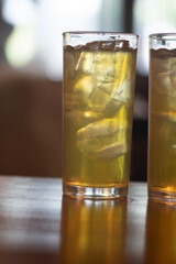 Glass of iced Japanese green tea in tall glass