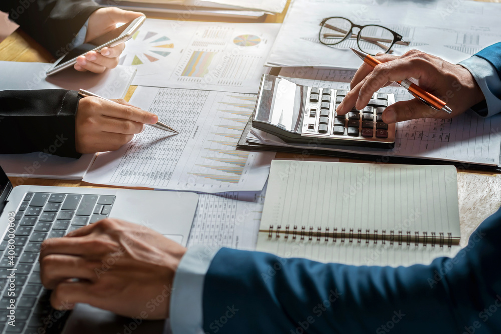 Poster businessman use calculator and computer for meeting with team accountant on desk in office. finance 