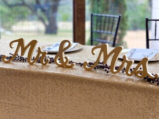 Mr and Mrs  signs at bride and groom table at wedding