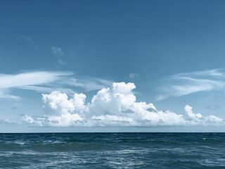 Clouds and horizon over ocean waves