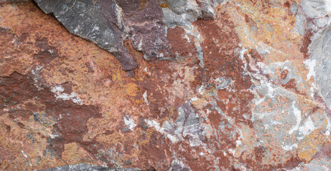 Stone cut - limestone with calcite onyx. Mineral composition: calcite, hematite, clay minerals. Color - shades of red-brown, white blotches. Torgashinskoye deposit, East Sayan, Krasnoyarsk Territory.