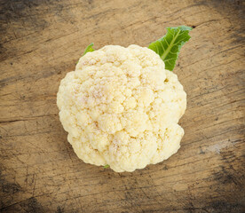 cauliflower isolated on wooden background