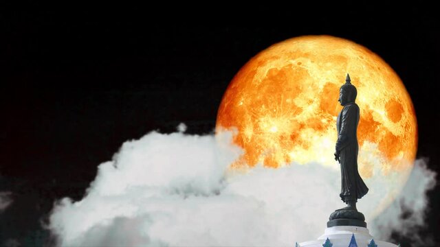 Full blood moon and Buddha looking seven day style on the night sky and white cloud time lapse, Makha Bucha Day is held full moon day on february or march