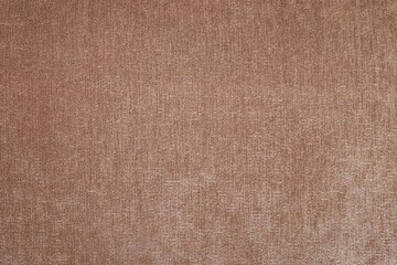 Fototapeta na wymiar The texture of coarse brown fabric is used for upholstery of rustic furniture.