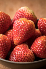 Studio photo of strawberries in a bowl.