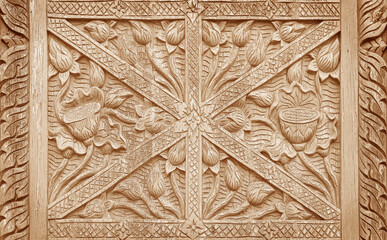 Pattern of flower carved on wood background