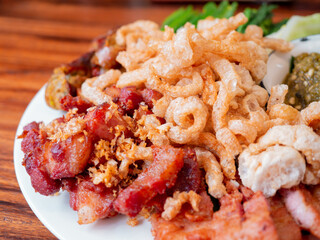 Hors d'oeuvre Mueang, Northen Thai style set of appitizer.  It usually contain fried porks, crispy porks, northern Thai sausages and spicy chilli sauce called Nam Phrik Num.