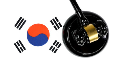 Naklejka premium Gavel and Korean national flag (Taegeukgi) isolated on white background. Nation and legal concept