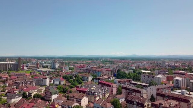 An aerial view of the buildings, roads, and water at the Brcko district, Bosnia and Herzegovina in HD
