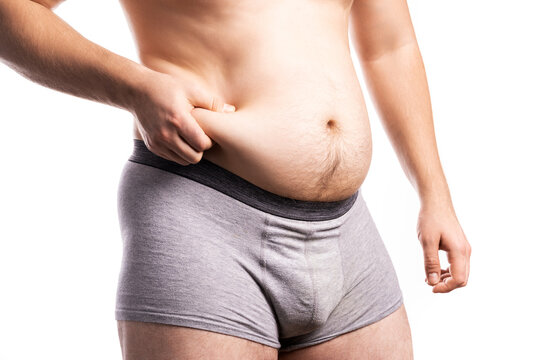 The man is holding onto his fat side