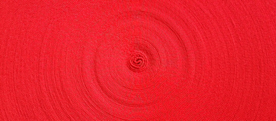 Red abstract circular pattern made of red sling