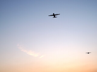 Fototapeta na wymiar Aircraft in the sunset sky