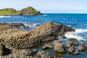 Landscape of Giant's Causeway trail with a blue sky in summer in Northern Ireland, County Antrim....