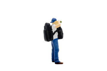 Miniature people traveller standing isolated on white background with clipping path