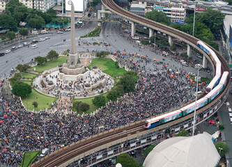 Protesters a three finger salute to show symbolic gestures at Democracy Monument