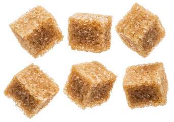 Brown sugar cubes on white background. Macro picture.