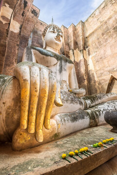 Famous big Buddha statue image named Phra Achana situated in ruined chapel at Wat Si Chum temple, Sukhothai Historical Park, Thailand