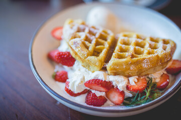 waffle pancake desert with vanilla ice cream, fresh strawberry and honey syrup - 408016805