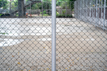 Close-up chain link fence , Sunset background
