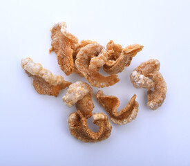 Pork snack or Pork rind leather lean pork fried crispy and blistered isoloated on white background. Thai food, Close-up
