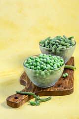 Quick-frozen green peas and string beans.